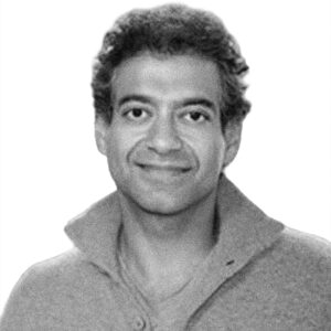 A black and white portrait of Indian software entrepreneur and angel investor, Naval Ravikant